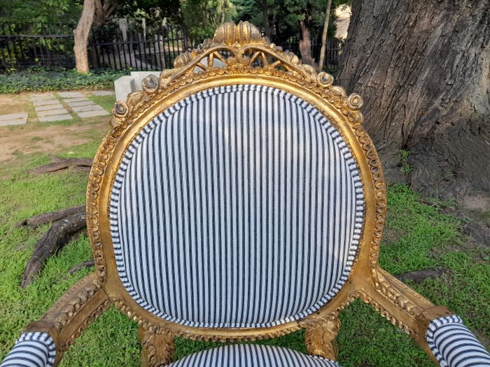 A 20th Century French Style Ornately Carved and Gilded Set Of Settee And a Pair Of Armchairs Upholstered in an Imported Fabric - Image 8