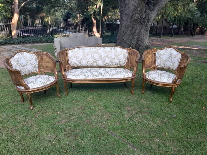 A Mid 20th Century Circa 1950 French Set Of Gilt Painted Wooden And Rattan Settee With A Pair Of Bergère Chairs Upholstered In A Custom Made Linen For The Crown Collection - Image 3