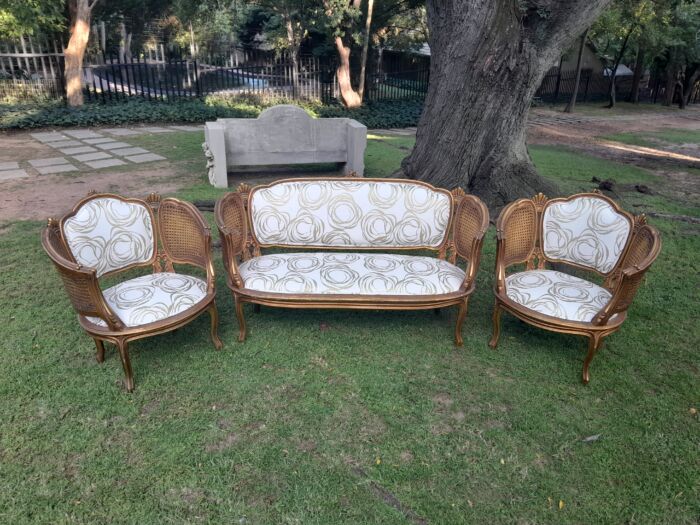 A Mid 20th Century Circa 1950 French Set Of Gilt Painted Wooden And Rattan Settee With A Pair Of Bergère Chairs Upholstered In A Custom Made Linen For The Crown Collection - Image 4