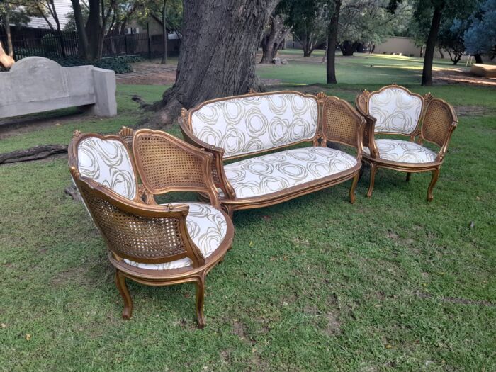 A Mid 20th Century Circa 1950 French Set Of Gilt Painted Wooden And Rattan Settee With A Pair Of Bergère Chairs Upholstered In A Custom Made Linen For The Crown Collection - Image 6
