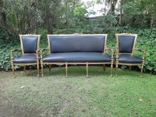 A 20th Century Set Of French Style Carved And Gilded Settee And Pair Of Armchairs Upholstered In Leather