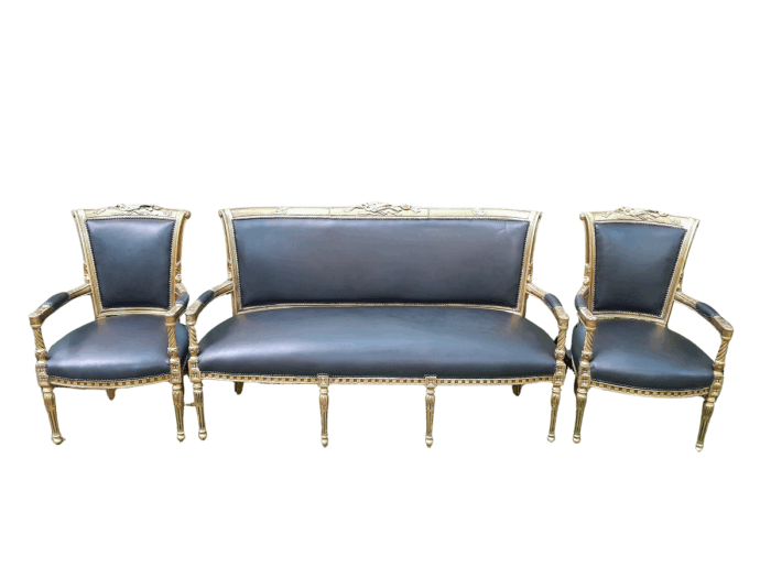 A 20th Century Set Of French Style Carved And Gilded Settee And Pair Of Armchairs Upholstered In Leather