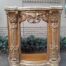 A 20TH Century French Style Ornately Hand Carved and Gilded Fireplace Surround