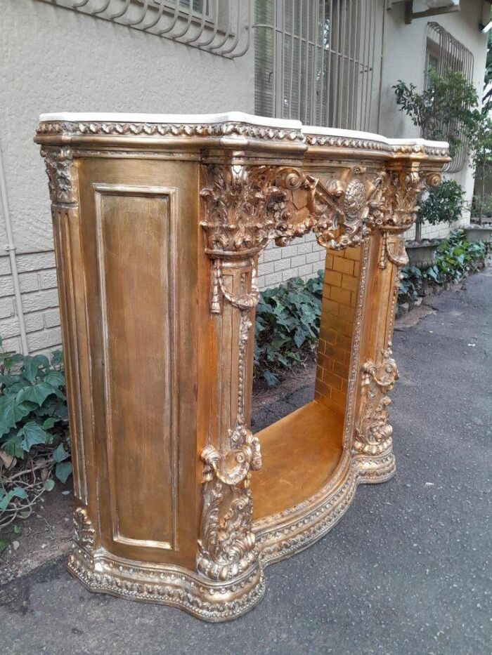 A 20TH Century French Style Ornately Hand Carved and Gilded Fireplace Surround - Image 3