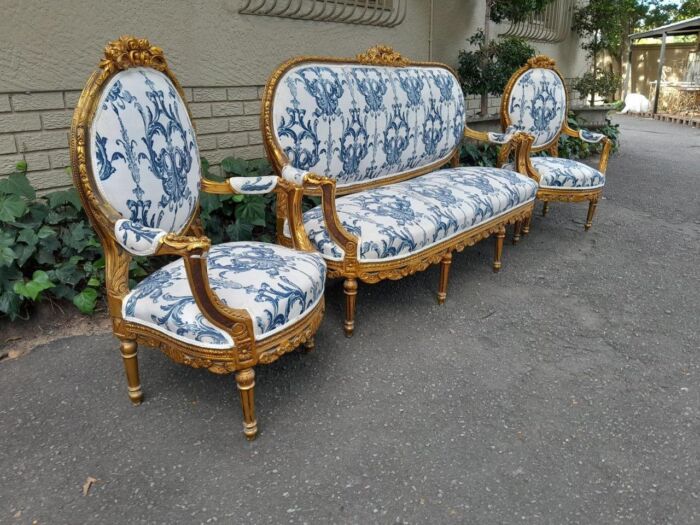 A 20TH Century French Louis XVI Style Set Of A Carved And Gilded Settee And Pair Of Armchairs - Image 3