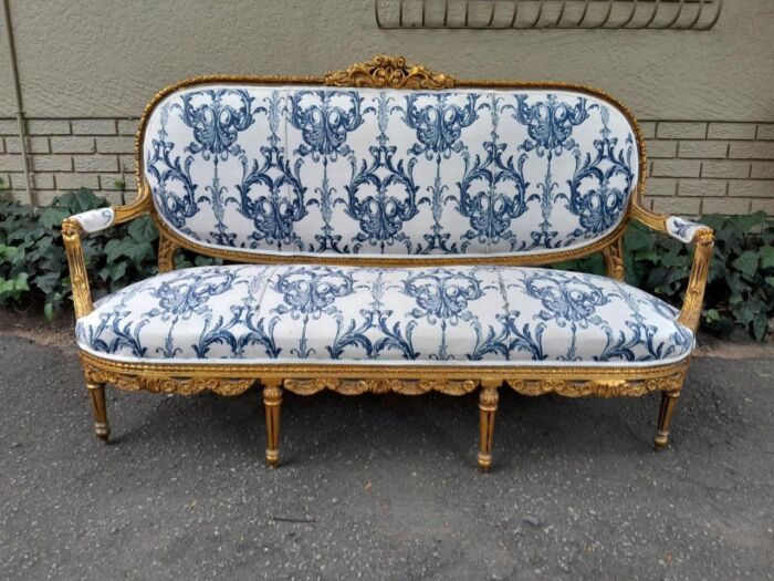 A 20TH Century French Louis XVI Style Set Of A Carved And Gilded Settee And Pair Of Armchairs - Image 4