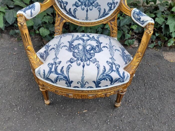 A 20TH Century French Louis XVI Style Set Of A Carved And Gilded Settee And Pair Of Armchairs - Image 8