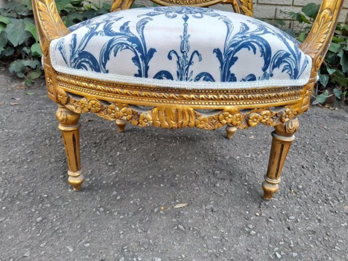 A 20TH Century French Louis XVI Style Set Of A Carved And Gilded Settee And Pair Of Armchairs - Image 10