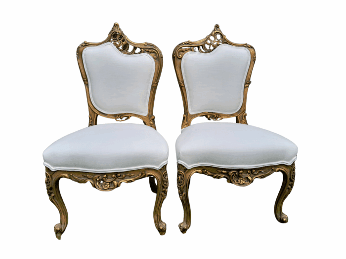 A Pair of French Rococo Style Carved Wooden Gilded Armchairs
