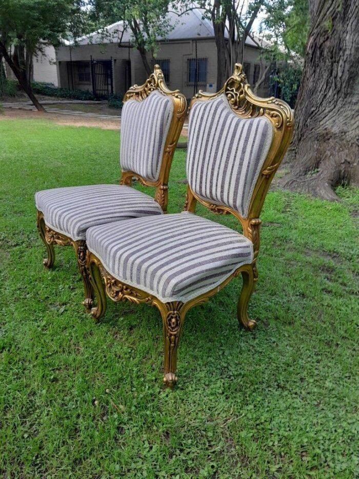 A Pair of French Rococo Style Carved Wooden Gilded Armchairs - Image 3