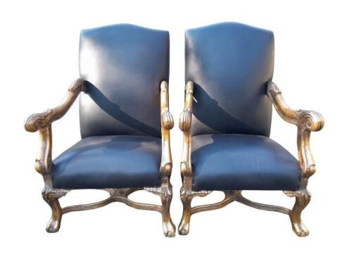 A French Louis XVI Style Pair Of Carved And Hand Gilded Armchairs Upholstered In Leather
