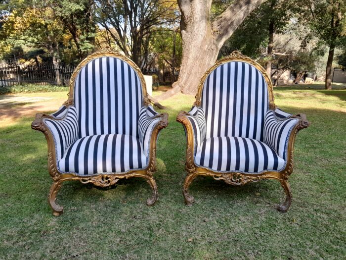 A 20th Century Pair of French Style Louis XVI Style Ornately Carved and Gilded Armchairs - Image 3