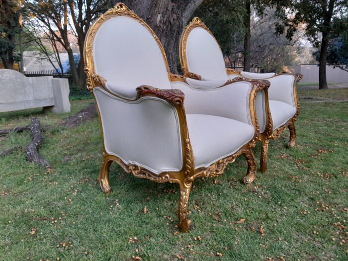 A 20th Century Pair of French Style Louis XVI Style Ornately Carved and Gilded Armchairs - Image 7