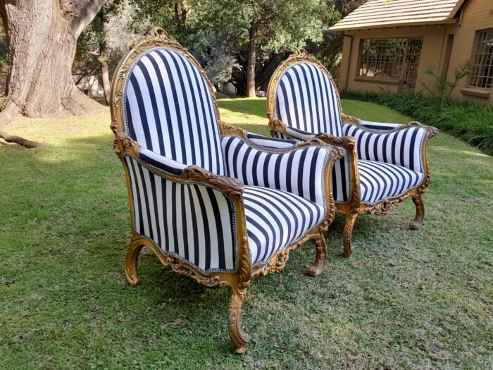 A 20th Century Pair of French Style Louis XVI Style Ornately Carved and Gilded Armchairs - Image 5