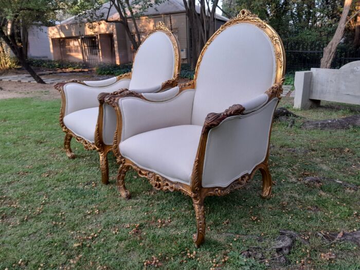 A 20th Century Pair of French Style Louis XVI Style Ornately Carved and Gilded Armchairs - Image 6
