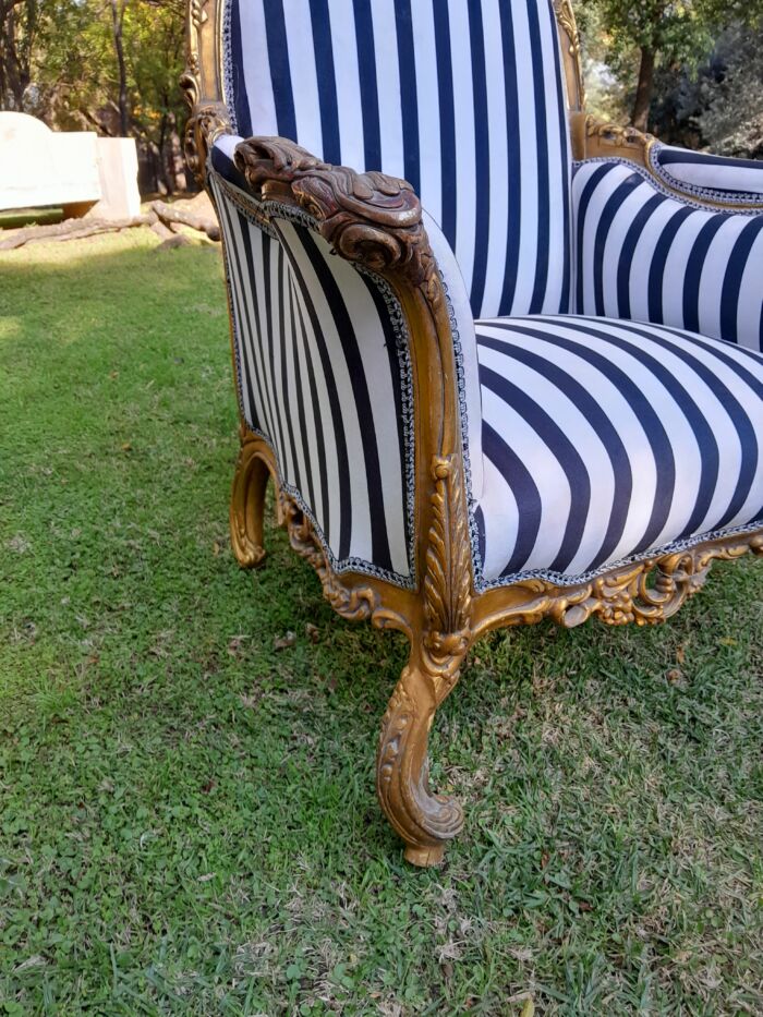 A 20th Century Pair of French Style Louis XVI Style Ornately Carved and Gilded Armchairs - Image 8