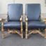 A 20th Century French Style Carved and Giltwood Arm Chairs Upholstered in Leather)