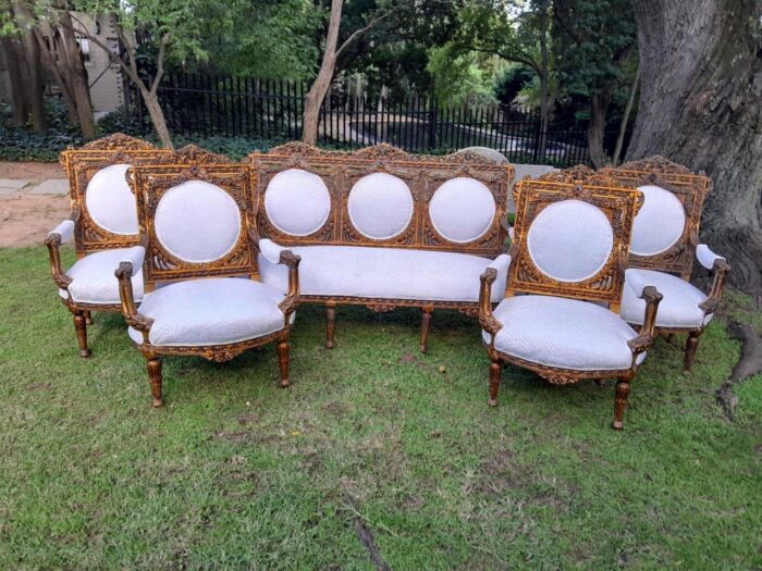 A 20th Century French Louis XVI Style Five Piece Set of Giltwood Settee and Four Armchairs - Image 2