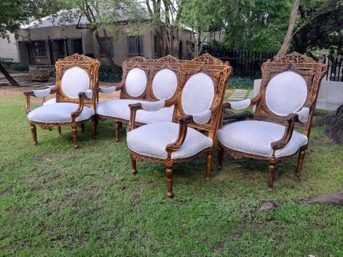 A 20th Century French Louis XVI Style Five Piece Set of Giltwood Settee and Four Armchairs - Image 3
