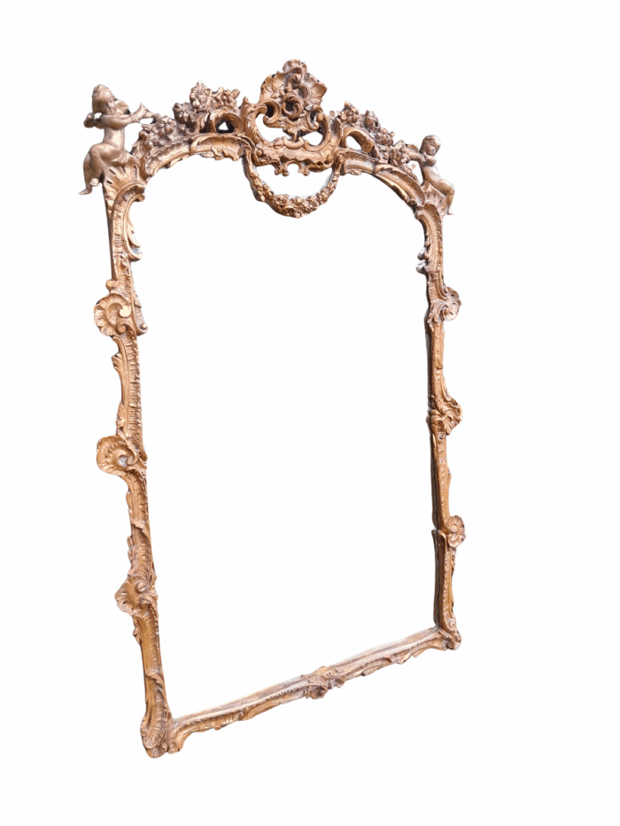 A French Rococo Style Ornately Carved and Gilded Bevelled Mirror 1
