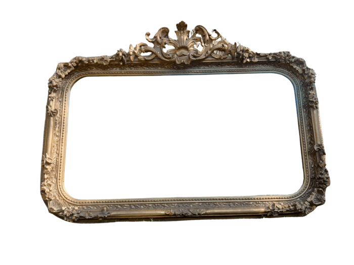 A French Style Ornately Carved and Gilded Bevelled Mirror