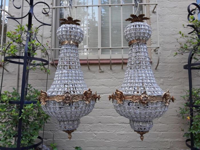 A French Style Pair of Brass Gilt Monumental Empire Chandeliers