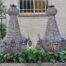 A Large Aged Pair of Monumental Empire French Style Chandeliers with Deer Head Figures