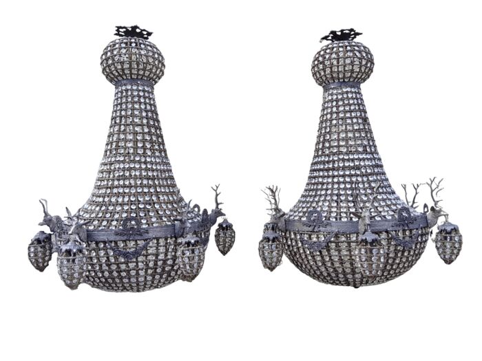 A Large Aged Pair of Monumental Empire French Style Chandeliers with Deer Head Figures