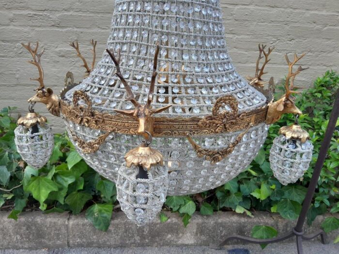 A Large Brass & Aged Pair of Monumental Empire French Style Chandeliers with Deer Head Figures - Image 4
