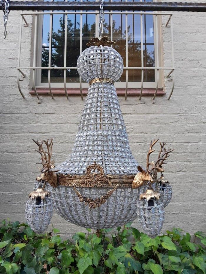 A French Style Pair of Aged Brass Pair of Monumental Empire Style Chandeliers with Deer Head Figures - Image 3