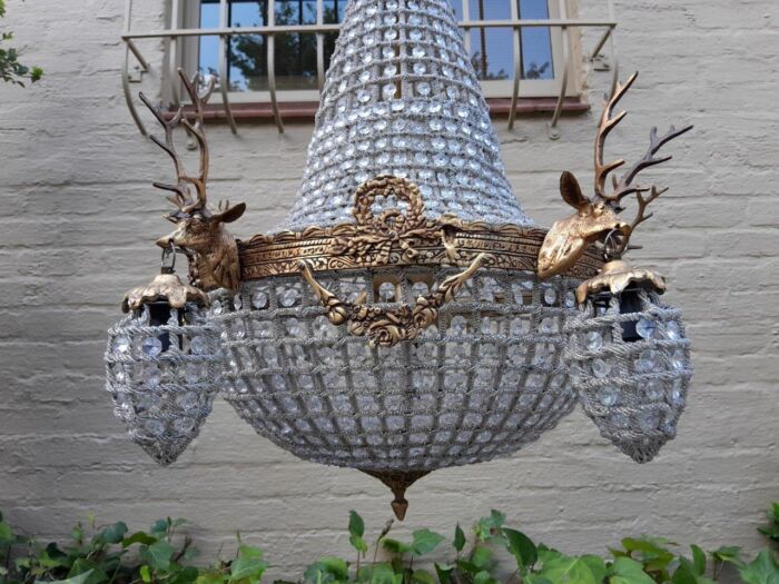 A French Style Pair of Aged Brass Pair of Monumental Empire Style Chandeliers with Deer Head Figures - Image 4
