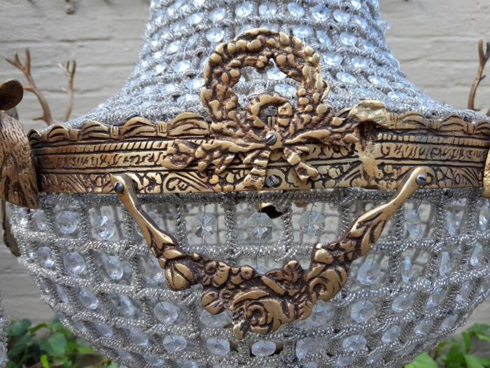 A French Style Pair of Aged Brass Pair of Monumental Empire Style Chandeliers with Deer Head Figures - Image 5