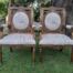 A 20TH Century French Style Pair of Ornately Carved and Gilded Armchairs Upholstered in a Custom-made Script Linen Fabric for The Crown Collection
