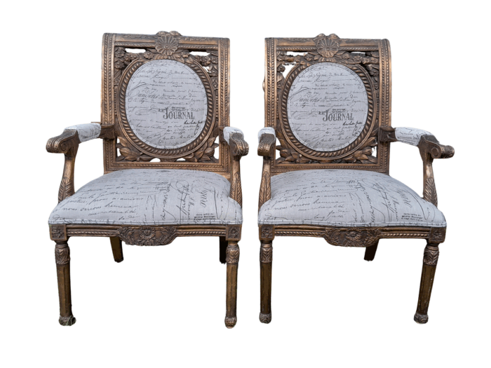 A 20TH Century French Style Pair of Ornately Carved and Gilded Armchairs Upholstered in a Custom-made Script Linen Fabric for The Crown Collection