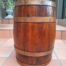 An Antique Teak and Brass Belted Machanick Co Wine Barrel