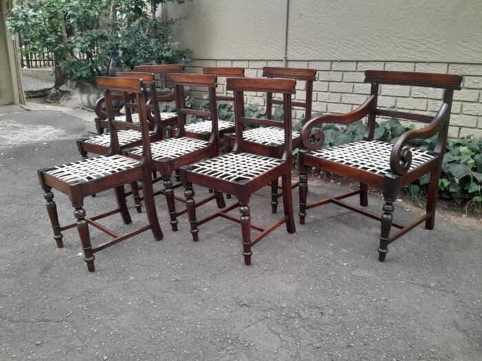 A 19th Century Set of Eight Cape Stinkwood Dining Charis with Riempie Seat Comprising Two Carvers and Six Dining Chairs  Provenance: The Tulbagh Saffer Collection - Image 4