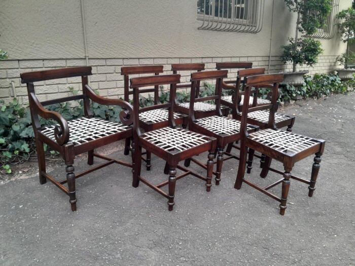 A 19th Century Set of Eight Cape Stinkwood Dining Charis with Riempie Seat Comprising Two Carvers and Six Dining Chairs  Provenance: The Tulbagh Saffer Collection - Image 5