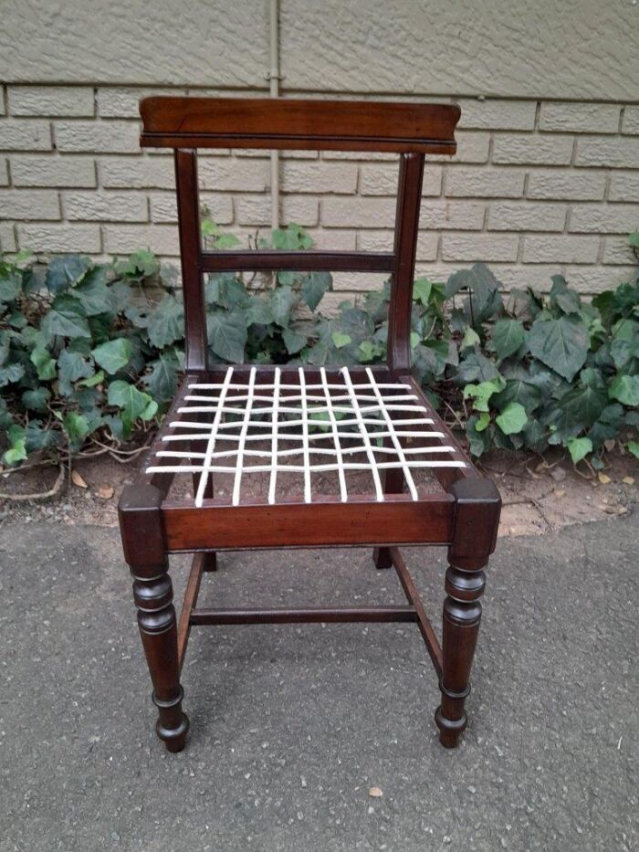 A 19th Century Set of Eight Cape Stinkwood Dining Charis with Riempie Seat Comprising Two Carvers and Six Dining Chairs  Provenance: The Tulbagh Saffer Collection - Image 8