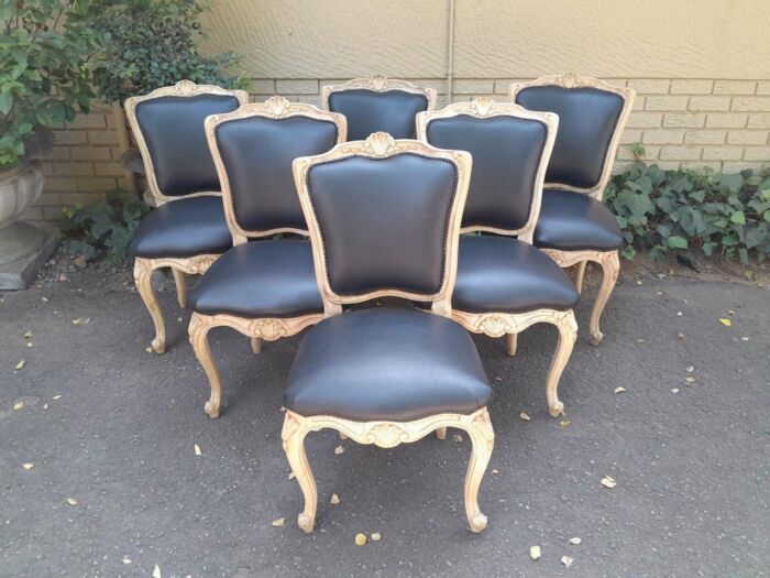 A 20th Set of Six French Style Dining Chairs in a Bleached Contemporary Finish and Upholstered in Leather - Image 2