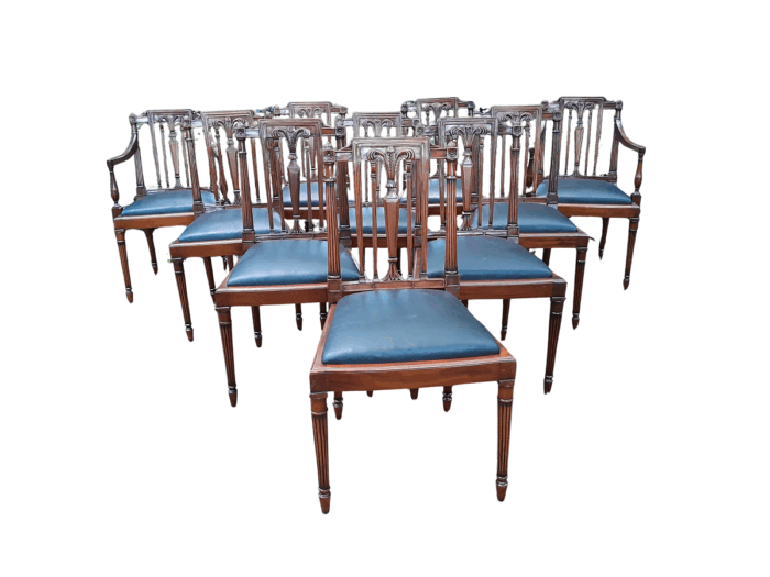 A 20th Century George III Hepplewhite Style Set of Ten Dining Chairs Comprising a Pair of Carvers / Armchairs and Eight Dining Chairs Upholstered in Leather 