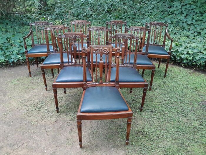A 20th Century George III Hepplewhite Style Set of Ten Dining Chairs Comprising a Pair of Carvers / Armchairs and Eight Dining Chairs Upholstered in Leather  - Image 2