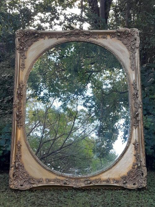 A 20TH Century Ornately Carved Gilt Wood Mirror