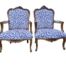 A 20th Century French Style Ornately Carved And Gilded Wooden Armchairs