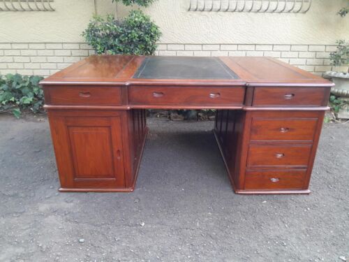 A 20th Century Large Rosewood Chesterfield Style Partners Desk With Tooled Leather Top
