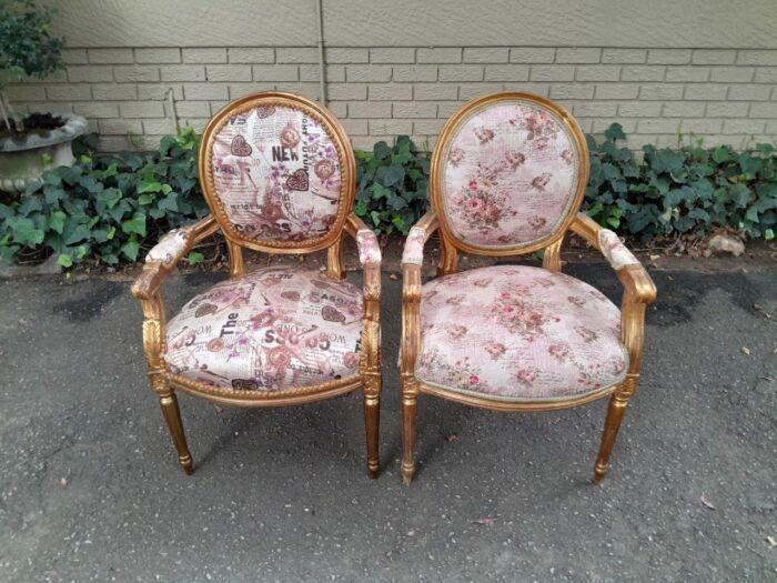 A 20th Century French Louis XVI Style Pair of Ornately Carved Gold Armchairs - Image 2