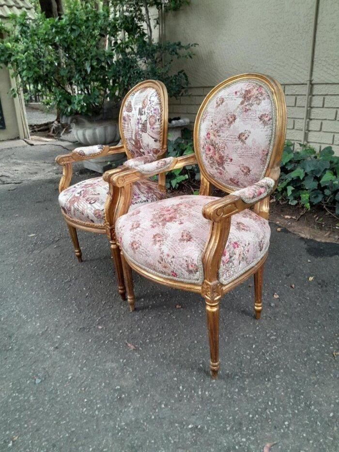 A 20th Century French Louis XVI Style Pair of Ornately Carved Gold Armchairs - Image 4