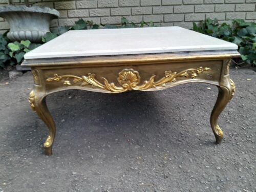 A 20th Century French Baroque Style Gilded Coffee Table with Cream Marble Top