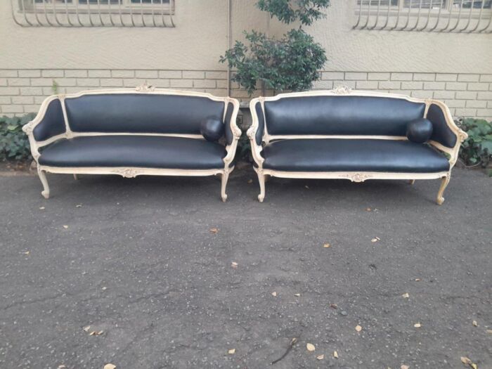 A 20th Century Pair of French Style Carved Walnut Settees in a Contemporary Bleached Finish and Upholstered in Leather with One Leather Decorative Ball Per Settee - Image 2