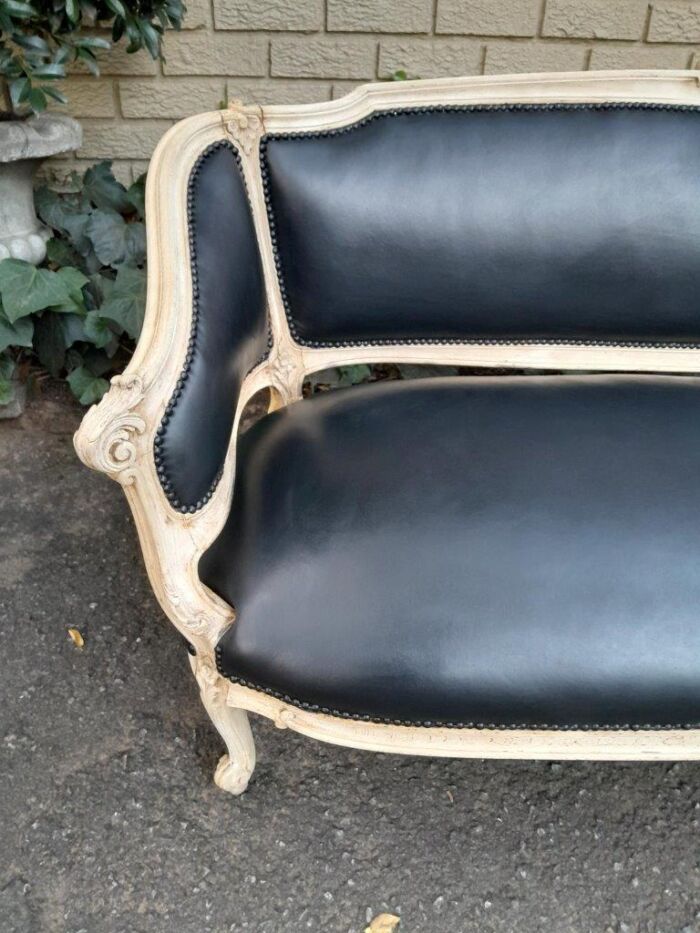 A 20th Century Pair of French Style Carved Walnut Settees in a Contemporary Bleached Finish and Upholstered in Leather with One Leather Decorative Ball Per Settee - Image 16