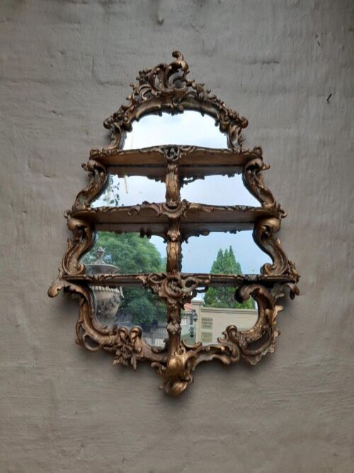 A 19th Century French Gilt and Carved Wooden Mirror with Three Shelves